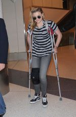 CHLOE MORETZ Sports Knee Brace at LAX Airport in Los Angeles