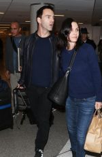 COURTNEY COX Arrives at LAX Airport in Los Angeles 1712