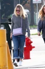 DAKOTA FANNIG Walks Her Dog Out in Los Angeles