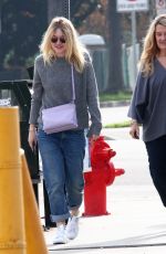 DAKOTA FANNIG Walks Her Dog Out in Los Angeles