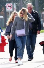DAKOTA FANNIG Walks Her Dog Out in Los Angeles