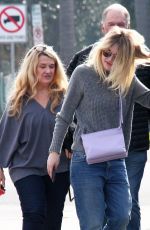 DAKOTA FANNIG Walks Her Dog Out in Los Angeles