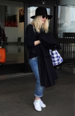 DAKOTA FANNING Leaves LAX Airport in Los Angeles 1912