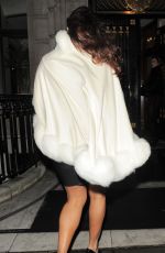 KELLY BROOK Arrives at a Christmas Party