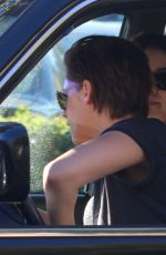 KRISTEN STEWART with a Friend Driving Around in Los Angeles