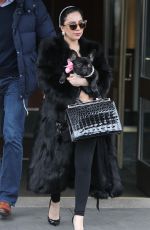 LADY GAGA in Fur Coats Leaves Her Apartment in New York