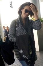 LILY COLLINS Arrives at Los Angeles International Airport