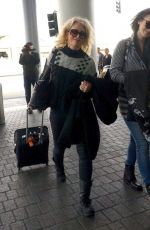 LILY COLLINS Arrives at Los Angeles International Airport