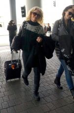 LILY COLLINS Arrives at Los Angeles International Airport