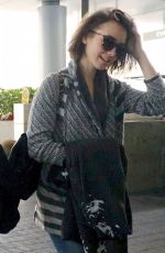 LILY COLLINS Arrives at Los Angeles International Airport