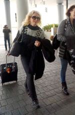 LILY COLLINS Arrives at Los Angeles International Airport