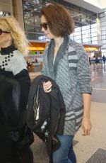 LILY COLLINS Arrives at Los Angeles International Airport