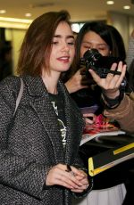 LILY COLLINS at Narita International Airport in Tokyo