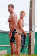 MARGOT ROBBIE in Bikini on the Beach in Byron Bay