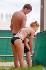 MARGOT ROBBIE in Bikini on the Beach in Byron Bay