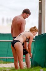 MARGOT ROBBIE in Bikini on the Beach in Byron Bay
