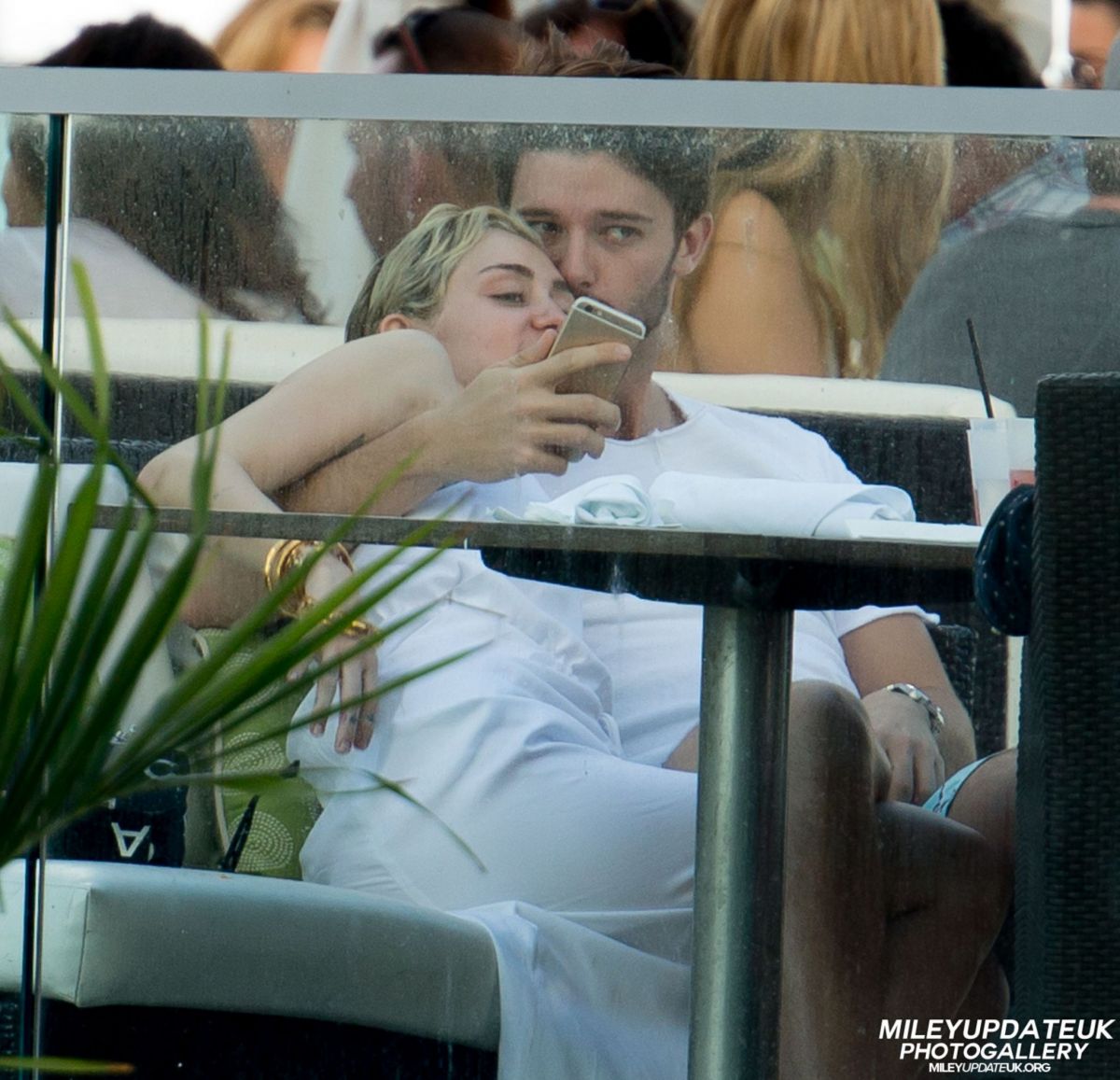 MILEY CYRUS and Patrick Schwarzenegger at a Restaurant in Malibu MILEY CYRUS and Patrick Schwarzenegger at a Restaurant in Malibu