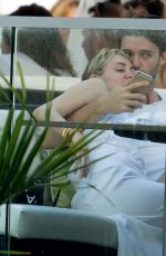MILEY CYRUS and Patrick Schwarzenegger at a Restaurant in Malibu