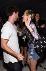 MILEY CYRUS and Patrick Schwarzenegger at Hublot Haute Living Party in Miami