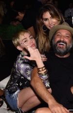 MILEY CYRUS and Patrick Schwarzenegger at Hublot Haute Living Party in Miami