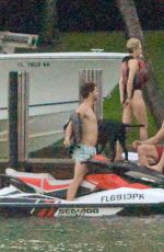 MILEY CYRUS and Patrick Schwarzenegger Jet Skiinng in Miami