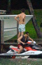 MILEY CYRUS and Patrick Schwarzenegger Jet Skiinng in Miami