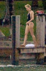 MILEY CYRUS and Patrick Schwarzenegger Jet Skiinng in Miami
