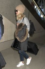 REESE WITHERSPOON Arrives at Los Angeles International Airport 0412