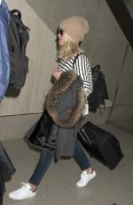 REESE WITHERSPOON Arrives at Los Angeles International Airport 0412
