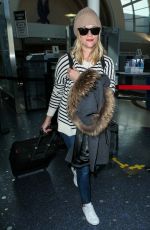 REESE WITHERSPOON Arrives at Los Angeles International Airport 0412