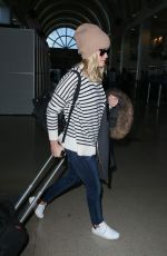 REESE WITHERSPOON Arrives at Los Angeles International Airport 0412
