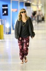 REESE WITHERSPOON Arrives at Miami International Airport 2012