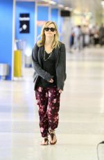 REESE WITHERSPOON Arrives at Miami International Airport 2012