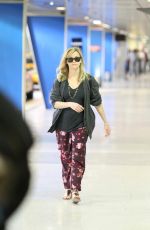 REESE WITHERSPOON Arrives at Miami International Airport 2012