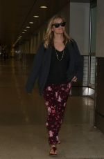 REESE WITHERSPOON Arrives at Miami International Airport 2012