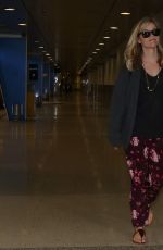 REESE WITHERSPOON Arrives at Miami International Airport 2012