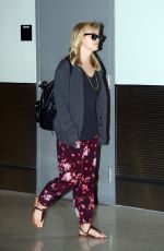 REESE WITHERSPOON Arrives at Miami International Airport 2012