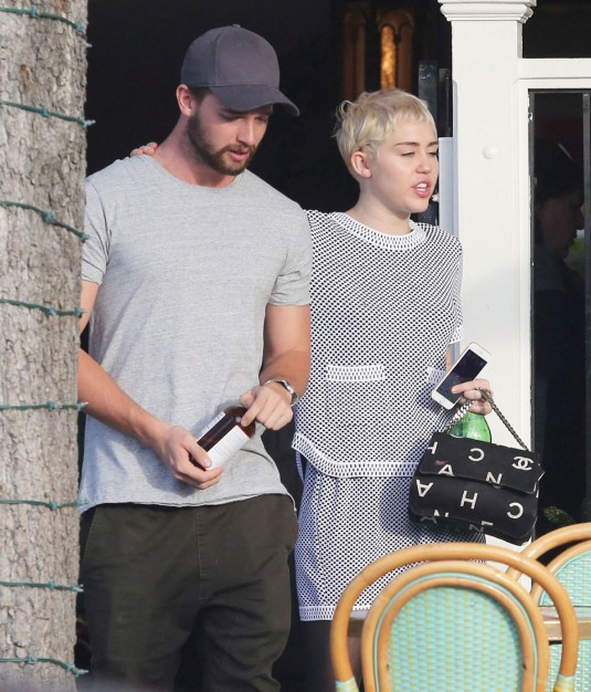 MILEY CYRUS and Patrick Schwarzenegger Leaves a Restaurant
