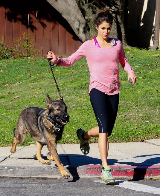 Nikki Reed takes her dog for a jog on New Years Eve in Los Angeles