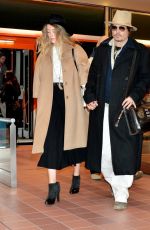 AMBER HEARD and Johnny Depp Arrives at Tokyo International Airport