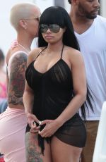 AMBER ROSE and BLAC CHYNA at a Pool in Miami