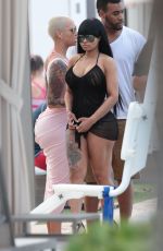 AMBER ROSE and BLAC CHYNA at a Pool in Miami