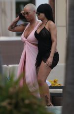 AMBER ROSE and BLAC CHYNA at a Pool in Miami