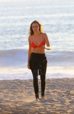 CARA DELEVINGNE in Bikini Top at a Beach in Malibu