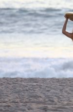 CARA DELEVINGNE in Bikini Top at a Beach in Malibu