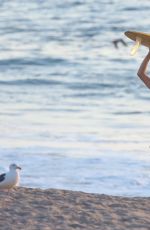 CARA DELEVINGNE in Bikini Top at a Beach in Malibu