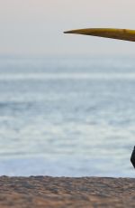 CARA DELEVINGNE in Bikini Top at a Beach in Malibu