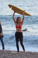 CARA DELEVINGNE in Bikini Top at a Beach in Malibu