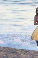 CARA DELEVINGNE in Bikini Top at a Beach in Malibu