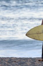 CARA DELEVINGNE in Bikini Top at a Beach in Malibu